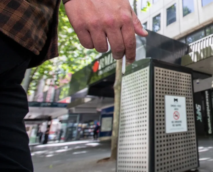 Person holding a cigarette.